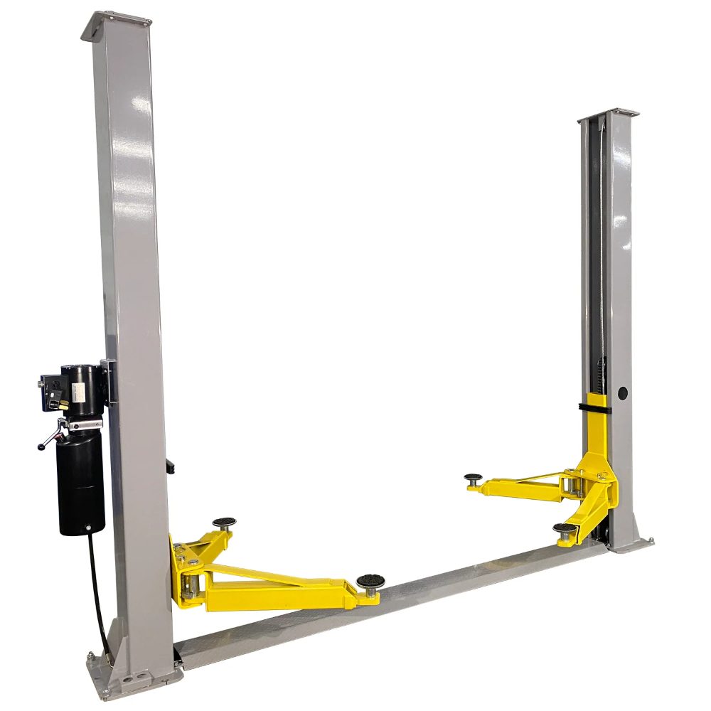 Angled view of Triumph NT-9 Two-Post Floor Plate Lift with floor plate and yellow lifting arms