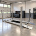 Triumph NSS-8XLT 8,000 lb Four-Post Car Lift with approach ramps in a professional garage