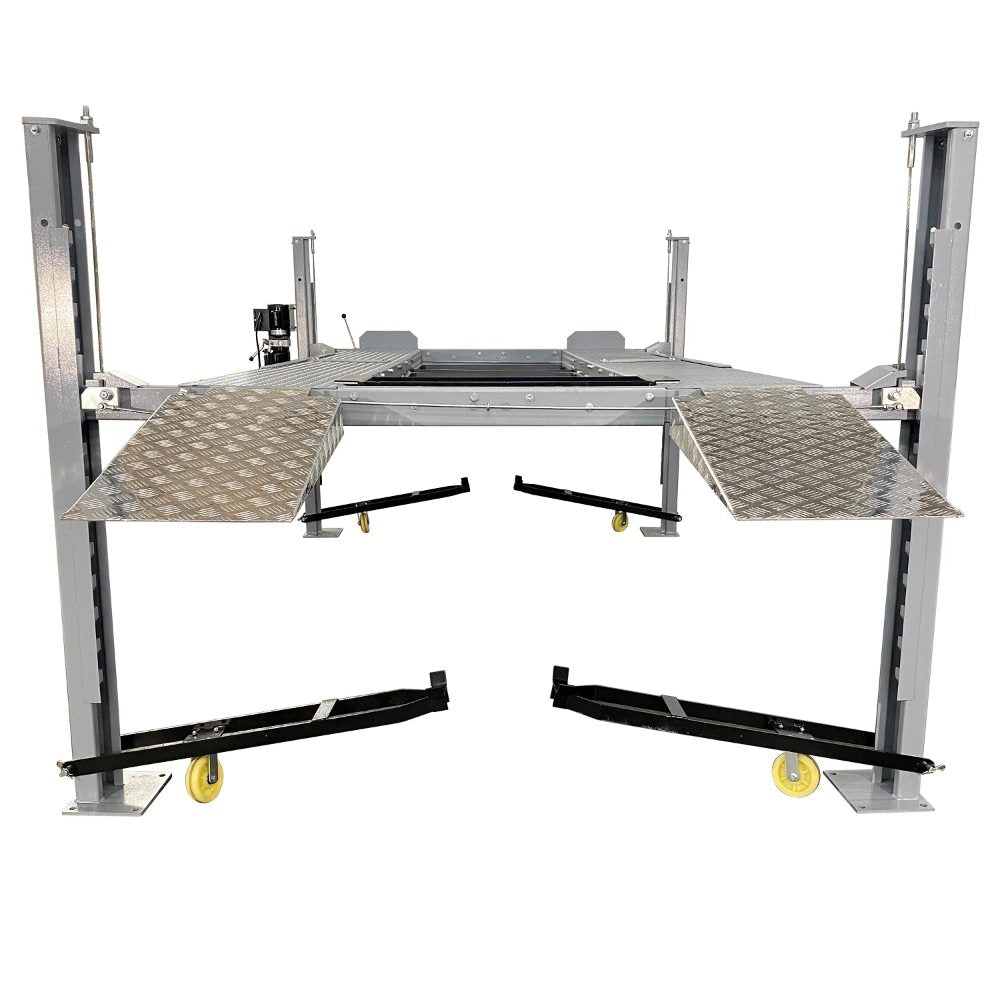 Triumph NSS8X-1 Four-Post Lift raised with ramps and caster wheels visible