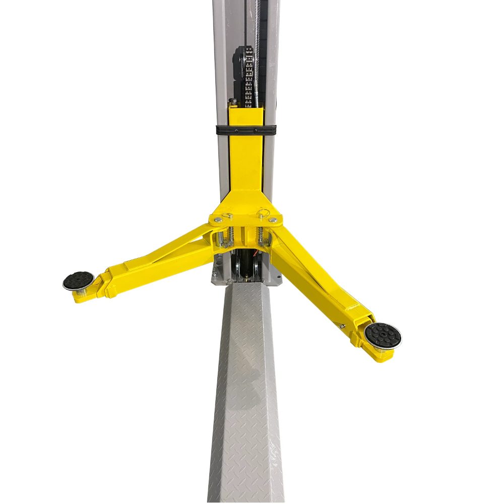 Triumph NT-9 Two-Post Floor Plate Lift close-up showing the yellow arms and floor plate