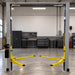 Triumph NTO-10A Overhead Two-Post Lift front view installed in a professional garage
