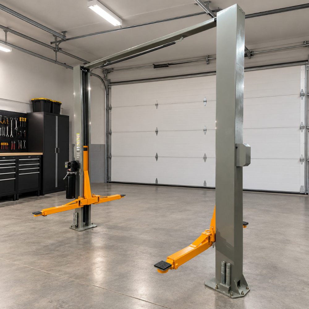 Triumph NTO-11A Overhead Two-Post Lift angled garage view showing overhead structure and orange lifting arms