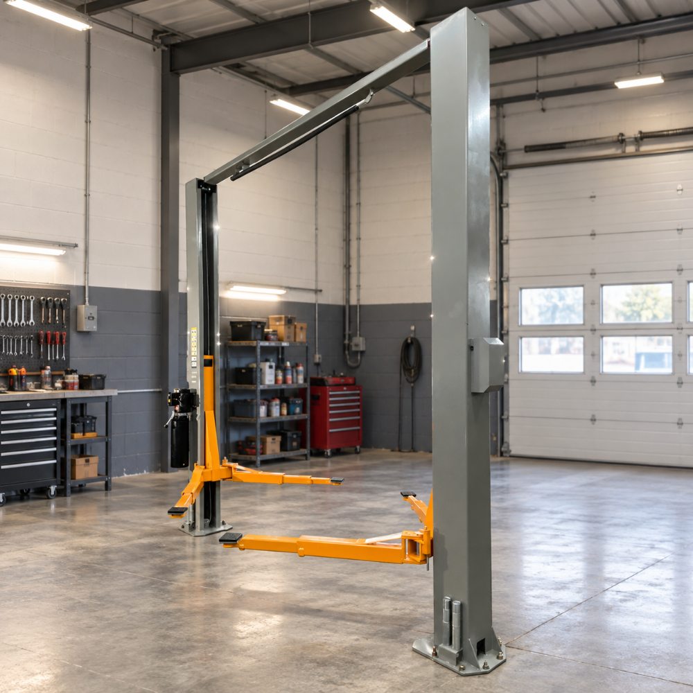 Triumph NTO-11A Overhead Two-Post Lift installed in a garage with grey columns and orange lifting arms