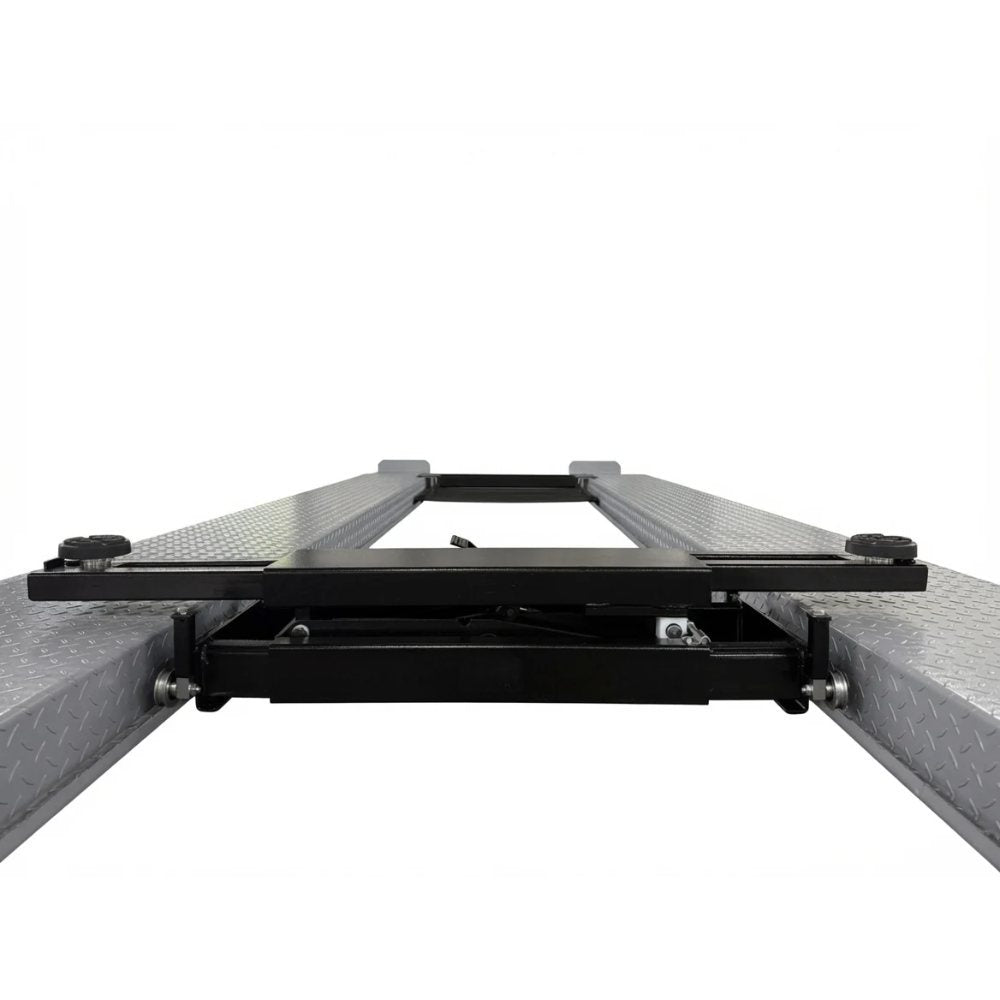 Triumph RJ-5000 5,000 lb Rolling Bridge Jack fully lowered between four-post lift runways