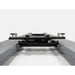 Triumph RJ-5000 5,000 lb Rolling Bridge Jack lowered between four-post lift runways